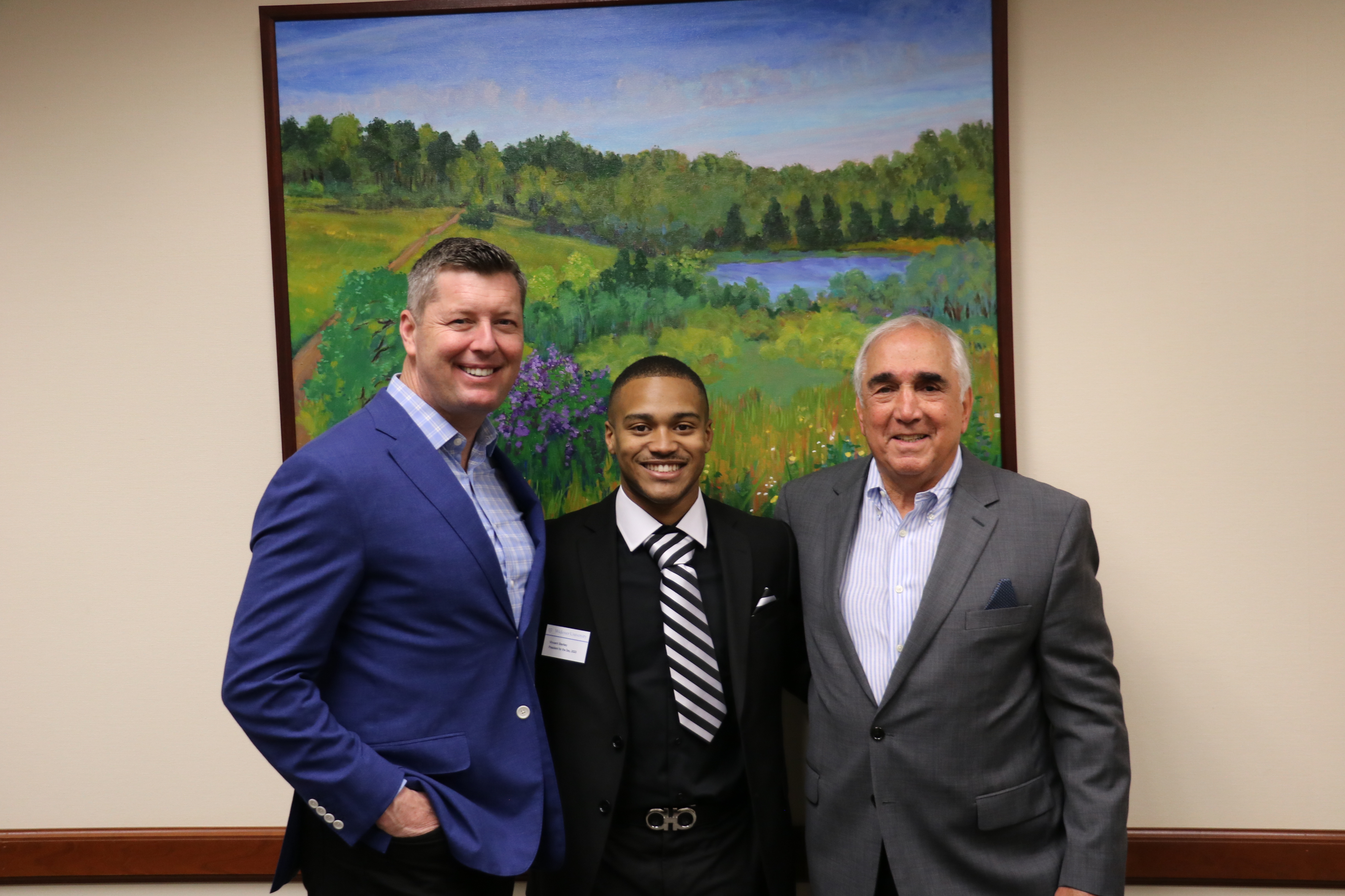 Patrick Murphy, Vincent Starkey, and Gen. John Tilelli pose for a photo.