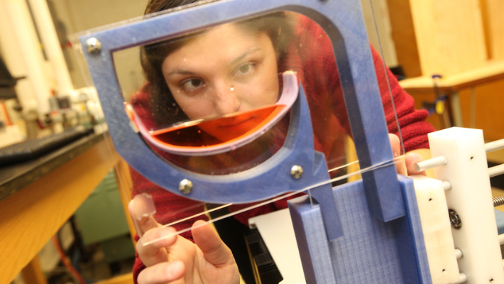 Graduate engineering student conducting research in a lab at Widener University.