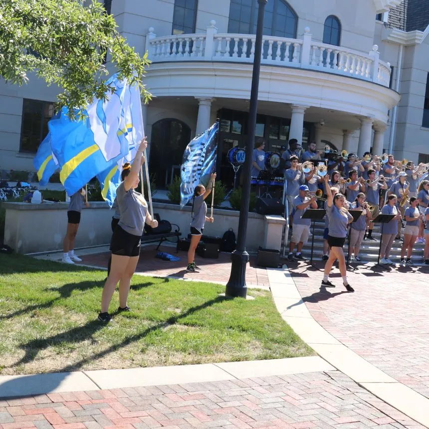 Color Guard performing at the Pride statue.