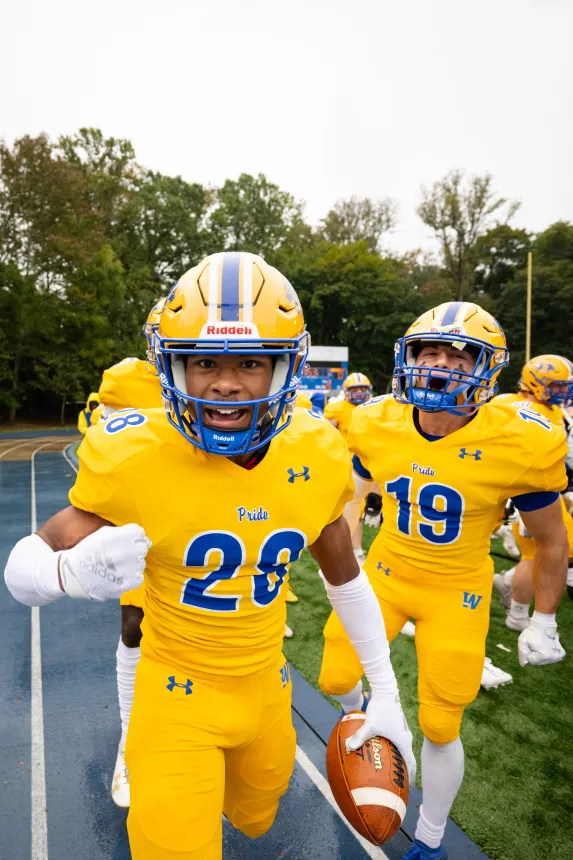 Football players stare into the camera 