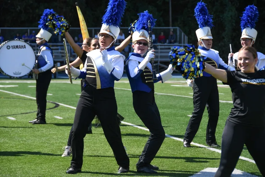 Two band students performing at halftime