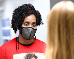 Child Development Center Director Essence Allen-Presley talks with a student