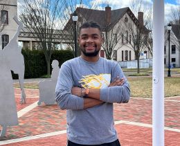 Xavier Ross poses in the Bown Garden on Widener's campus.