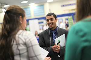 Student networking at career fair