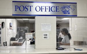 Post Office widow with student worker