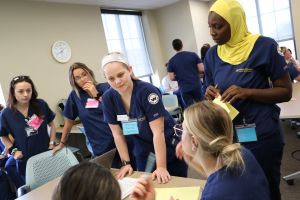Rachael Waid coordinates with classmates at the simulated command center.