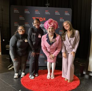 Amanda Rappa poses with students and TEDx presenter Brent Satterly.