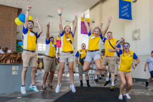 C.R.E.W. leaders jump with joy in the University Center at Widener University.