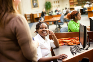 Two students chat at Widener University's Wolfgram Memorial Library.