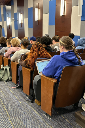 Students on their computers during an interactive AI workshop
