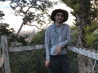 Student Zan Usmani standing in the Amazon rainforest in Peru