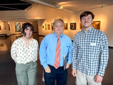 Cloe DiFlumeri poses alongside two individuals during an internship at Museum of Arts and Sciences.