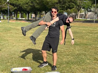 Nursing student Samuel Flood does a fireman carry during an on-campus emergency response workshop.