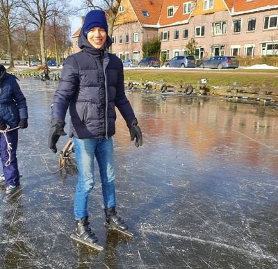 International exchange student Daniël van der Spoel ice skates on a pond in the Netherlands