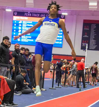 Matayo McGraw, wearing a Widener track uniform, in mid-jump