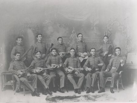 Eleven members of the Pennsylvania Military Academy mandolin and guitar club, pose for a photo holding their instruments