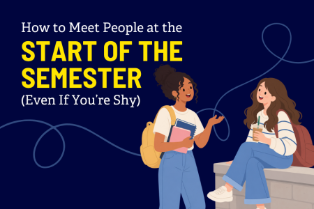 Two college students at Widener meet and chat at the start of the semester, with one sitting on a low wall holding a drink and the other standing nearby with books and a backpack.