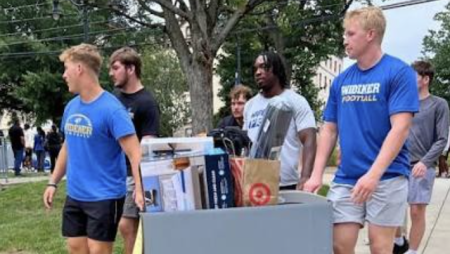 Widener football team helps new students move into their residence halls