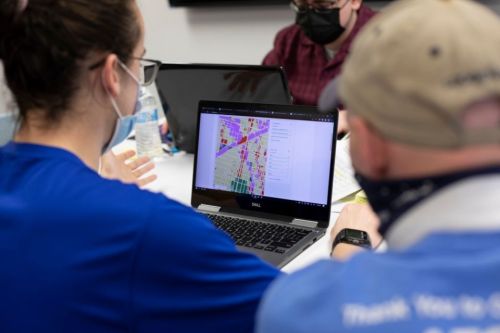 Civil engineering student project header 960 x 640 Civil engineering teammates review a color-coded map of Philadelphia on a computer screen.