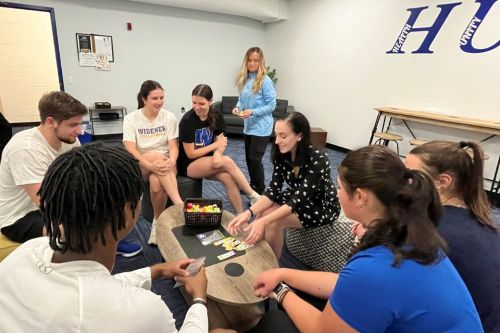 Student athletes playing a game in the HUB space