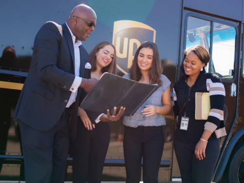 Widener students speak with a UPS employee during co-op.
