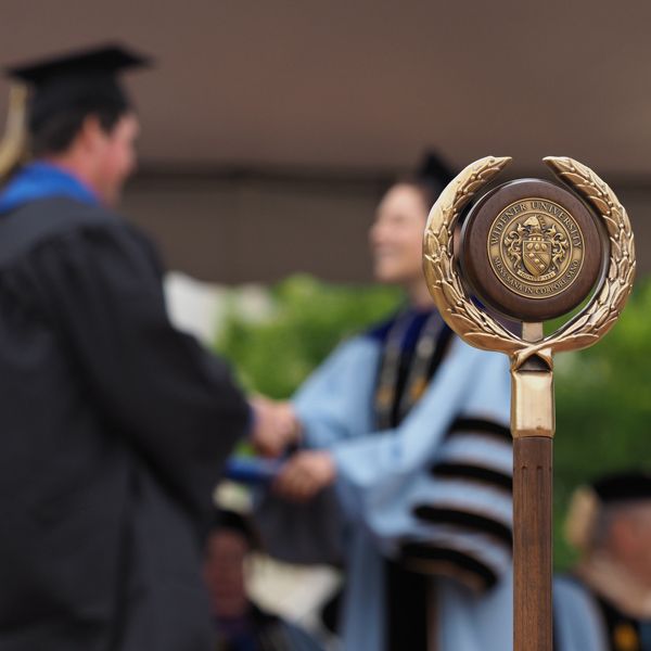 Student receiving diploma at graduation