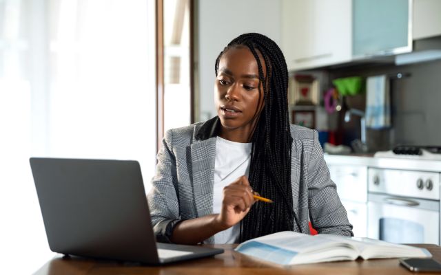 professional student at home on laptop