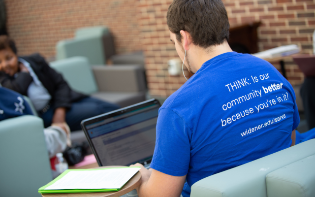 Student studying on laptop at Widener's University Center.
